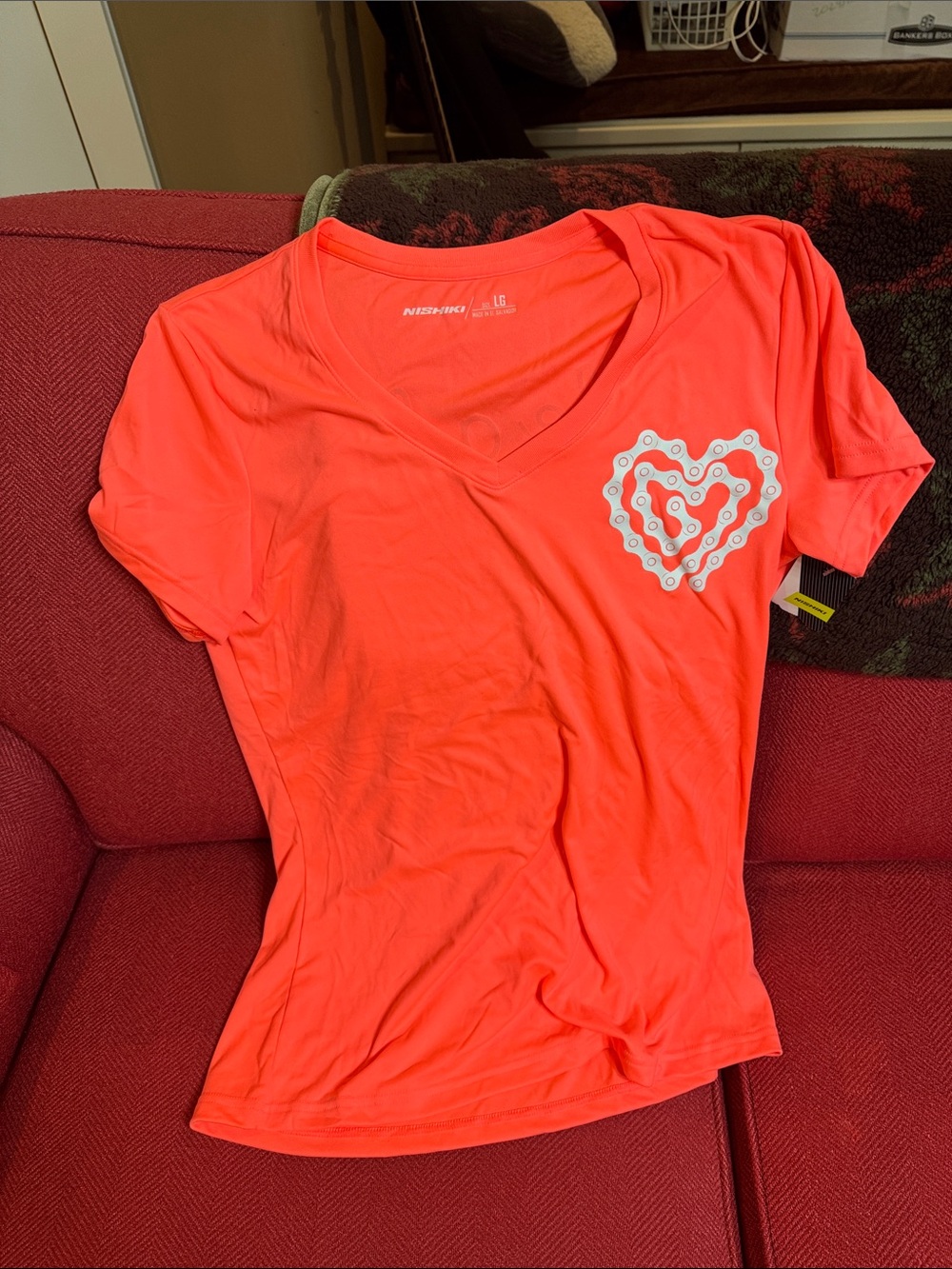 Women's Nishiki V-Neck Coral Pink Short Sleeve Bike Top with Heart Graphic